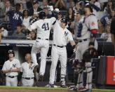 Boston Red Sox's Chris Sale (41) celebrates with Luke Voit after hitting a home run during the second inning of a baseball game, while Boston Red Sox catcher Sandy Leon stands at right Wednesday, Sept. 19, 2018, in New York. (AP Photo/Frank Franklin II)