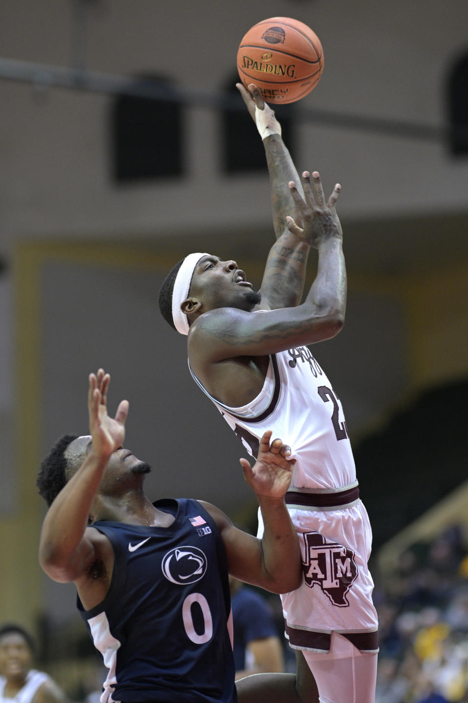 Texas A&M guard Tyrece Radford, right, shoots in front of Penn State guard Kanye Clary (0) during the second half of an NCAA college basketball game, Thursday, Nov. 23, 2023, in Kissimmee, Fla. (AP Photo/Phelan M. Ebenhack)