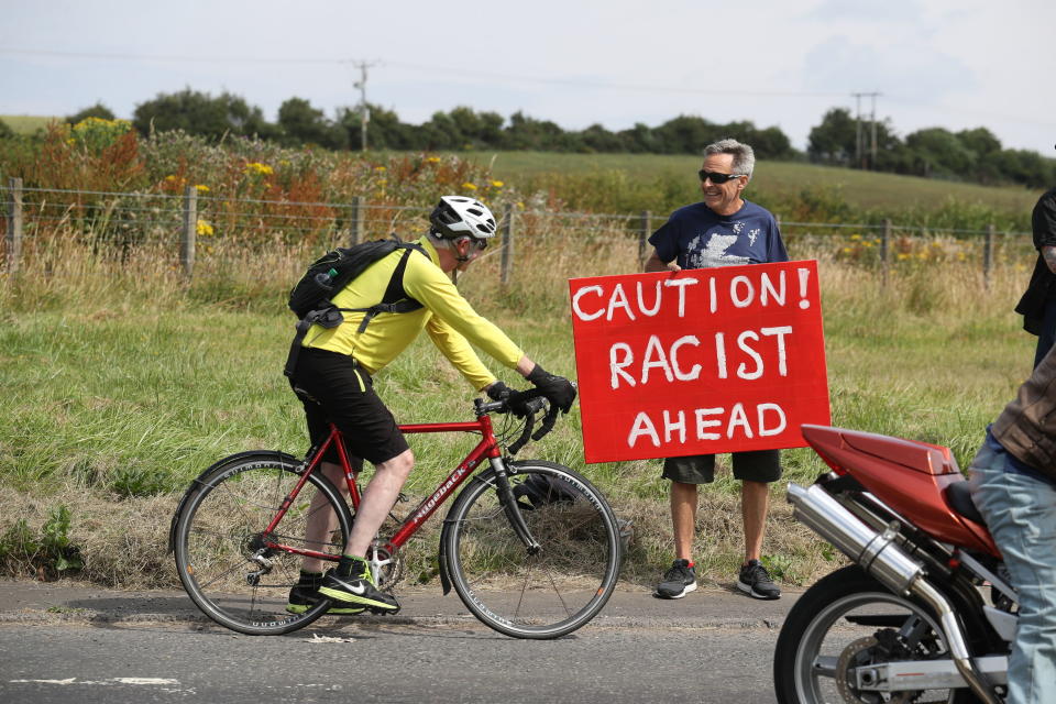 <p>A protester rides his bike near Turnberry, where President Trump and first lady Melania Trump are spending the weekend at the Trump Turnberry resort in South Ayrshire, Scotland. (Photo: Andrew Milligan/PA Images via Getty Images) </p>