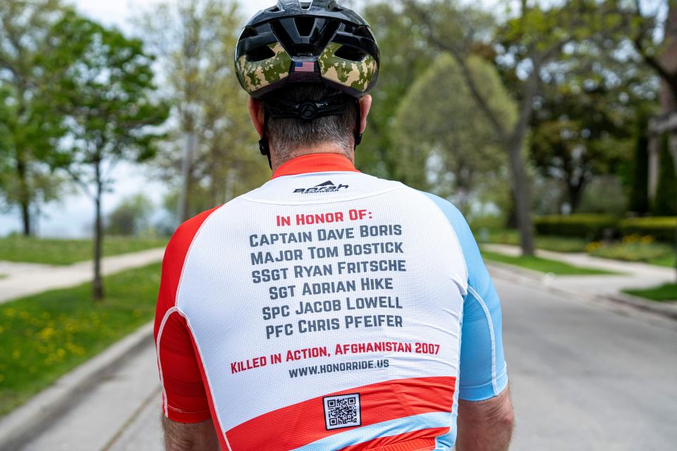 Retired U.S. Army Col. Chris Kolenda trains for a 1,700-mile cycling tour on Tuesday in Milwaukee,. The cycling tour will consist of visiting the gravesites of six members of his military unit who were killed in action in Afghanistan.