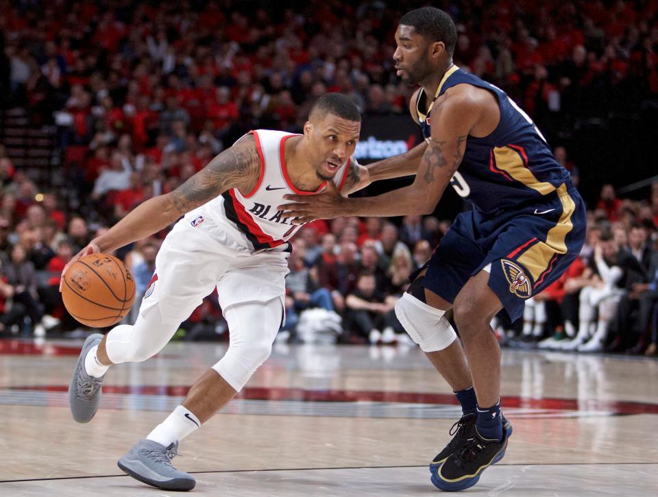 Damian Lillard skipped Monday’s NBA Awards show and instead hung out with some Blazers fans in Portland handing out shoes and autographs. (AP)