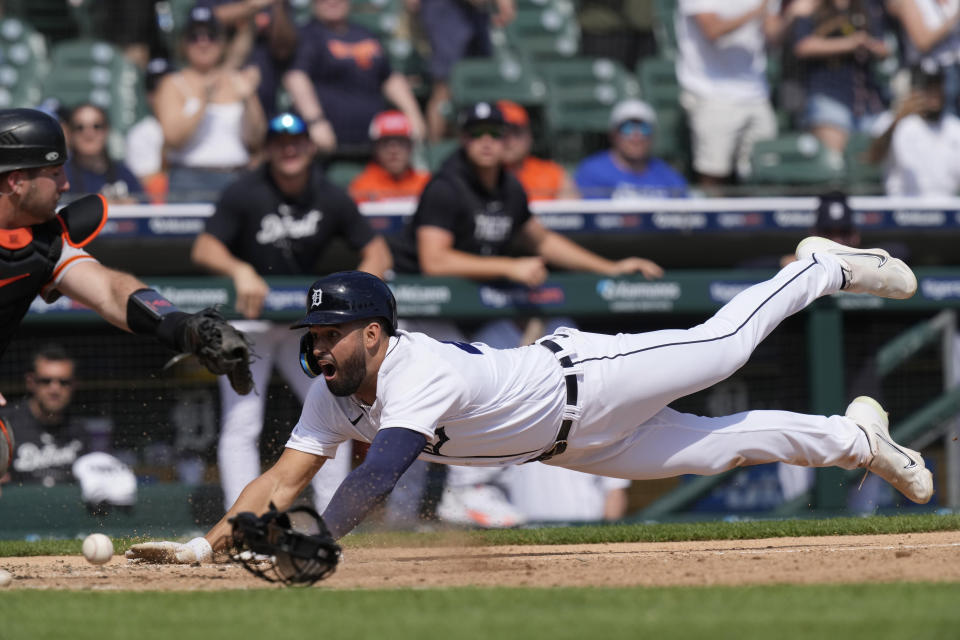 Detroit Tigers' Riley Greene beats the throw to San Francisco Giants catcher Joey Bart to score during the eighth inning of a baseball game, Saturday, April 15, 2023, in Detroit. (AP Photo/Carlos Osorio)