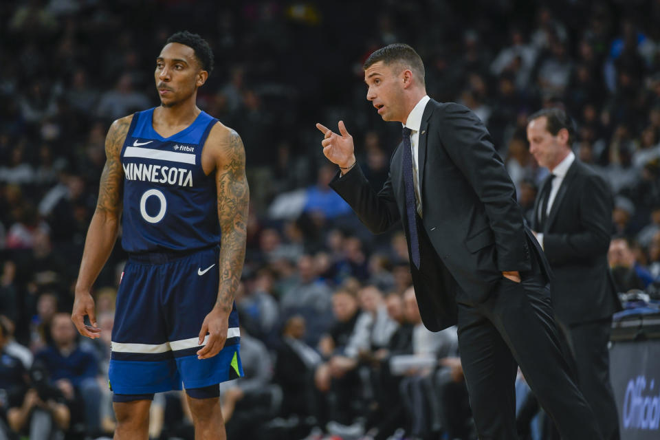 Minnesota Timberwolves head coach Ryan Saunders, right, talks with Minnesota Timberwolves guard Jeff Teague during a break in the action against the Brooklyn Nets during the second half of an NBA basketball game Monday, Dec. 30, 2019, in Minneapolis. (AP Photo/Craig Lassig)