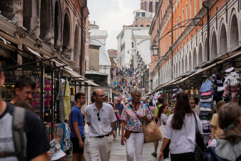 Venice attracts millions of tourists a year from around the world – so much so that the city has decided to levy an entry fee (AP)