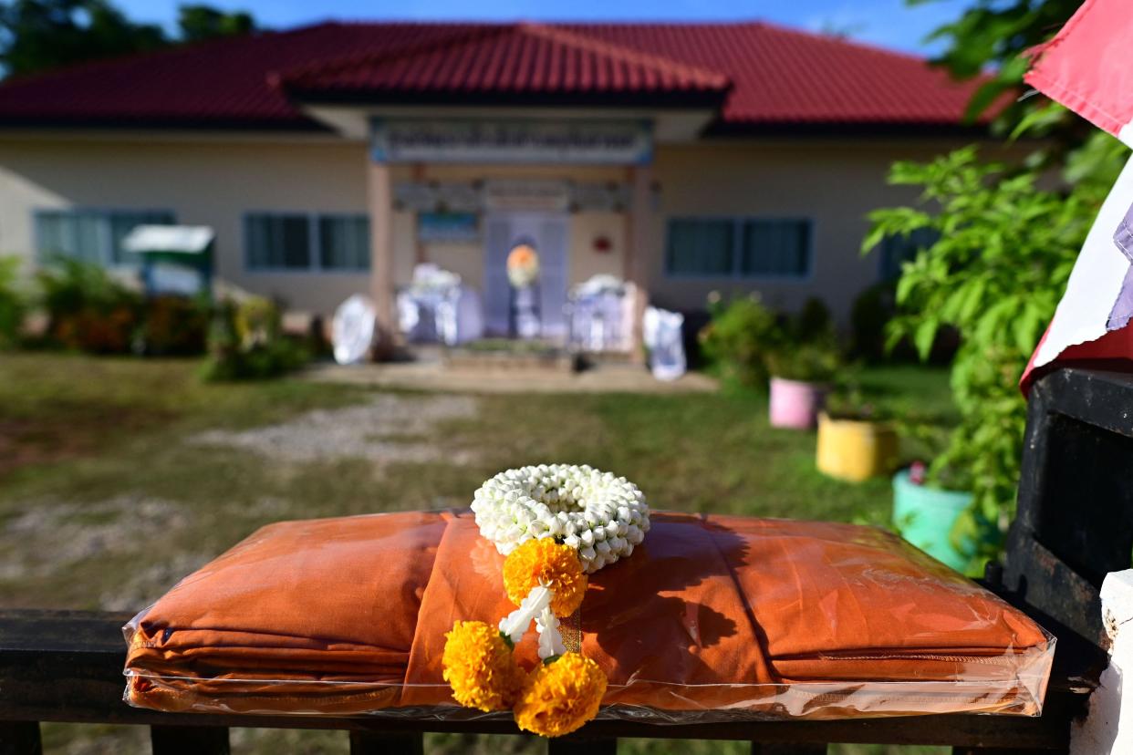 A prayer offering is displayed outside the nursery, where a mass shooting by a former police officer took place, in Na Klang in Thailand's northeastern Nong Bua Lam Phu province on October 7, 2022. - Weeping, grief-stricken families gathered on October 7 outside a Thai nursery where an ex-policeman murdered two dozen children in one of the kingdom's worst mass killings. (Photo by Manan VATSYAYANA / AFP) (Photo by MANAN VATSYAYANA/AFP via Getty Images)