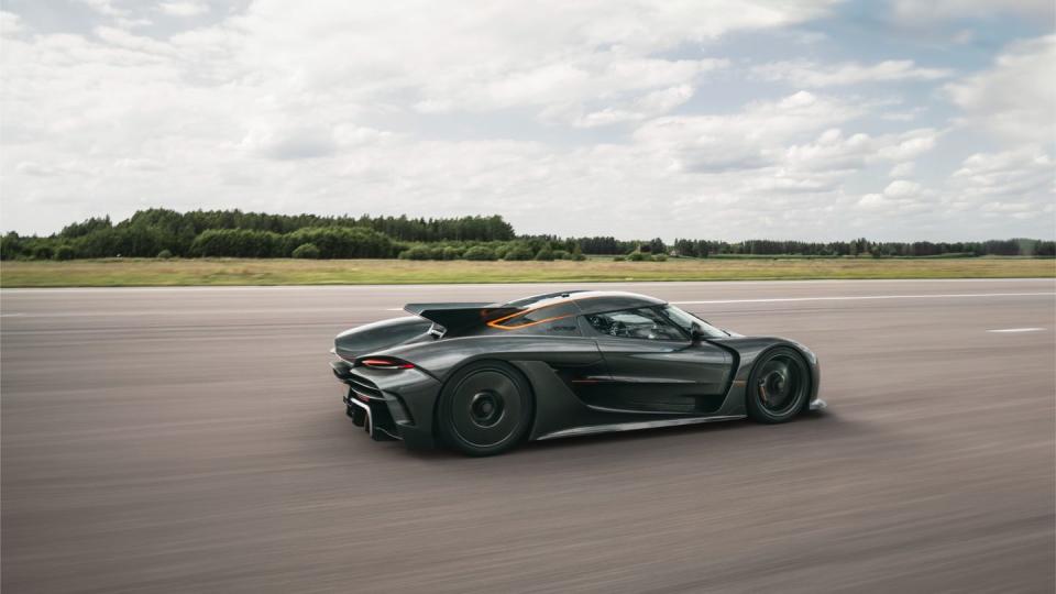 a black sports car on a road