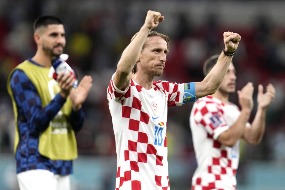 Croatia's Luka Modric and his teammates celebrate after winning the World Cup group F soccer match between Croatia and Belgium at the Ahmad Bin Ali Stadium in Al Rayyan , Qatar, Thursday, Dec. 1, 2022. Croatia defeated Belgium 1-0. (AP Photo/Thanassis Stavrakis)