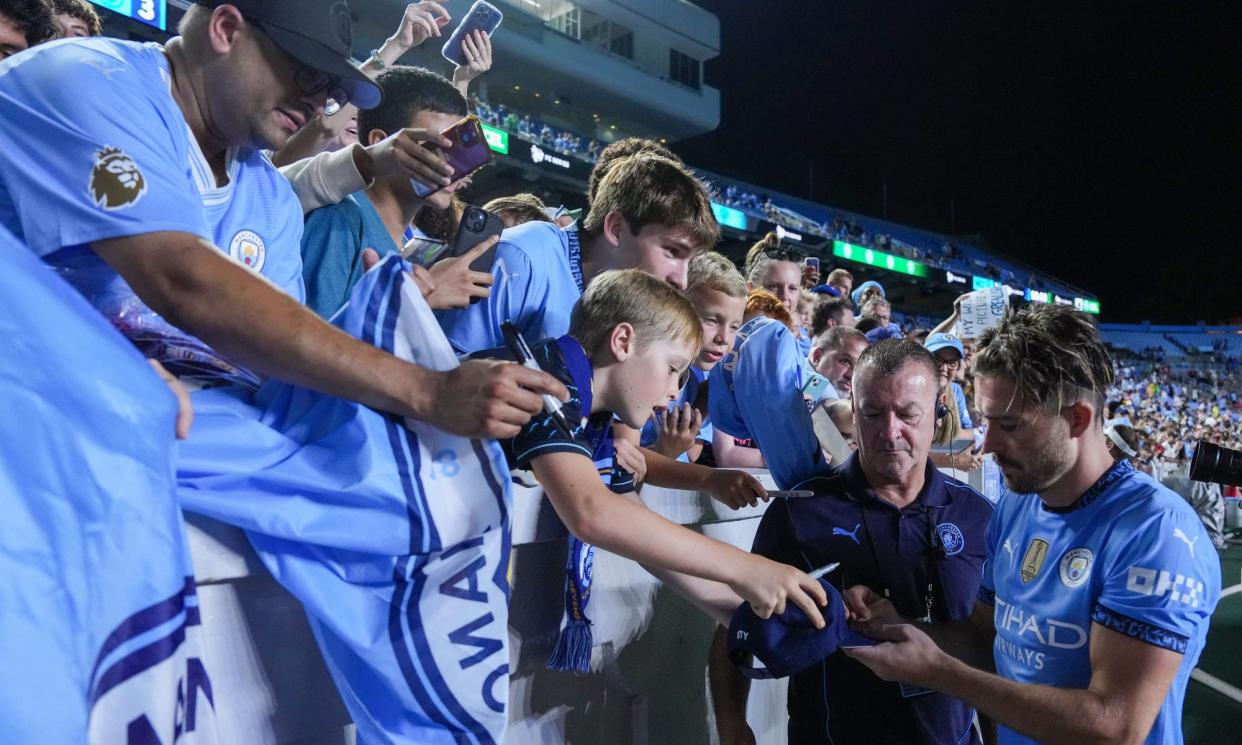 <span>Jack Grealish signs autographs in North Carolina after Manchester City’s friendly against Celtic this week. Could there be competitive games soon?</span><span>Photograph: Grant Halverson/Getty Images</span>