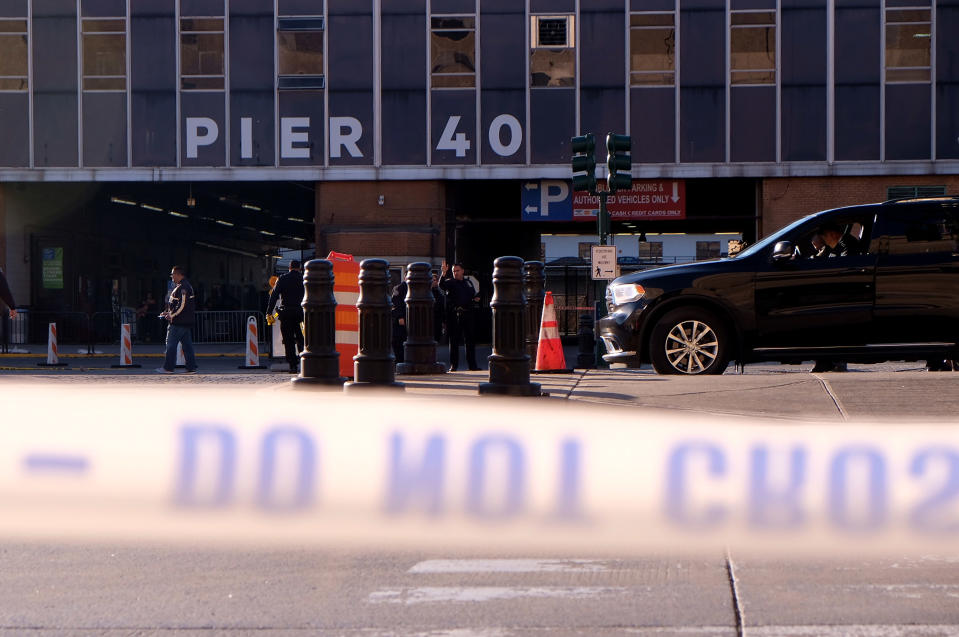 <p>Police gather at the scene after reports of multiple people injured after a truck plowed through a bike path in lower Manhattan on Oct. 31, 2017 in New York City. (Photo: Andy Kiss/Getty Images) </p>