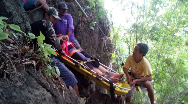 Ms Gavios being taken from the cliff scene. Source: The Phuket News