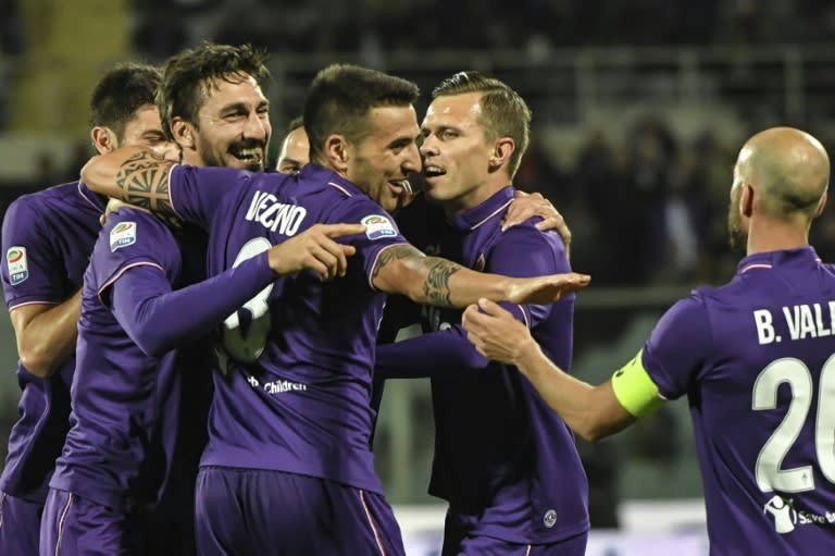 Fiorentina's Davide Astori (2ndL) celebrates with teammates after scoring against Inter Milan, on April 22, 2017 at Florence's "Artemio Franchi" communal stadium