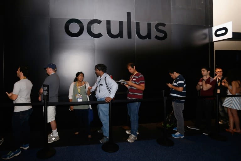 Game enthusiasts and industry personnel stand in line at the Oculus VR exhibit at the Annual Gaming Industry Conference E3 at the Los Angeles Convention Center on June 16, 2015 in Los Angeles, California