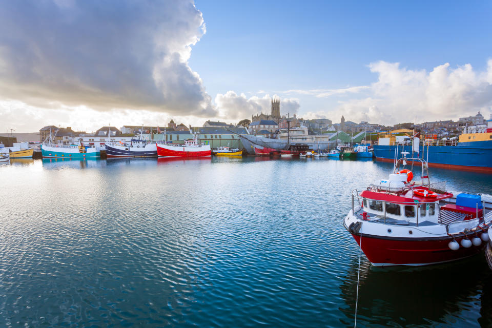 Stroll along Penzance Harbour. [Photo: Getty]