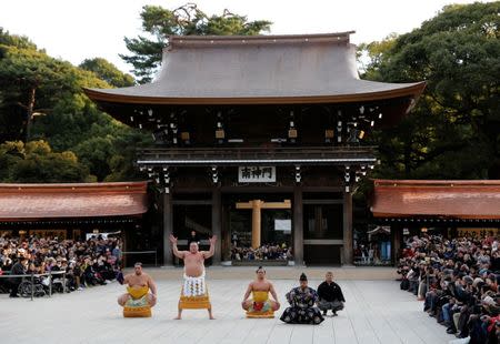 Mongolian-born grand sumo champion Yokozuna Hakuho (2nd L) performs the New Year's ring-entering rite at the annual celebration for the New Year at Meiji Shrine in Tokyo, Japan January 6, 2017. REUTERS/Issei Kato