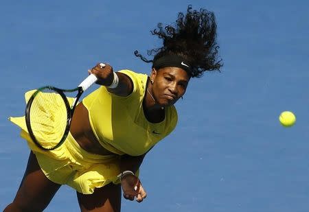 Serena Williams of the U.S. serves during her quarter-final match against Russia's Maria Sharapova at the Australian Open tennis tournament at Melbourne Park, Australia, January 26, 2016. REUTERS/Jason Reed