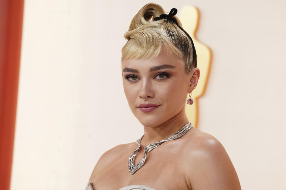 Florence Pugh arrives at the Oscars on Sunday, March 12, 2023, at the Dolby Theatre in Los Angeles. (Photo by Jordan Strauss/Invision/AP)