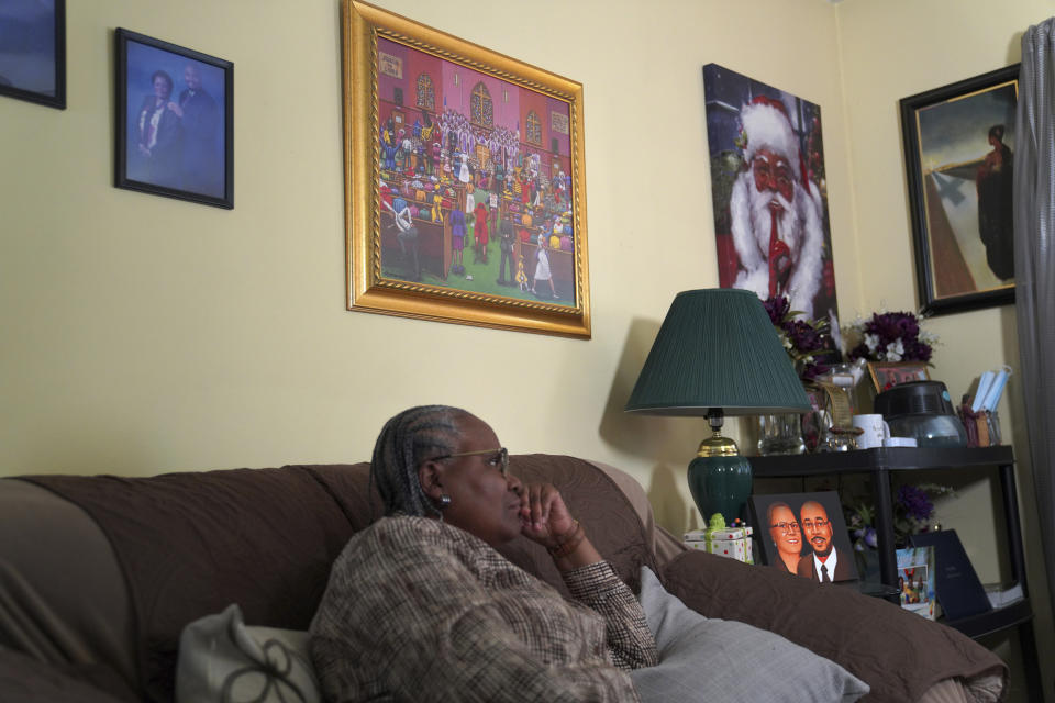 Wendy Owens, a United Methodist Minister, listens to her son, Lama Rod Owens, at her home in Rome, Georgia on Saturday, March 30, 2024. (AP Photo/Jessie Wardarski)