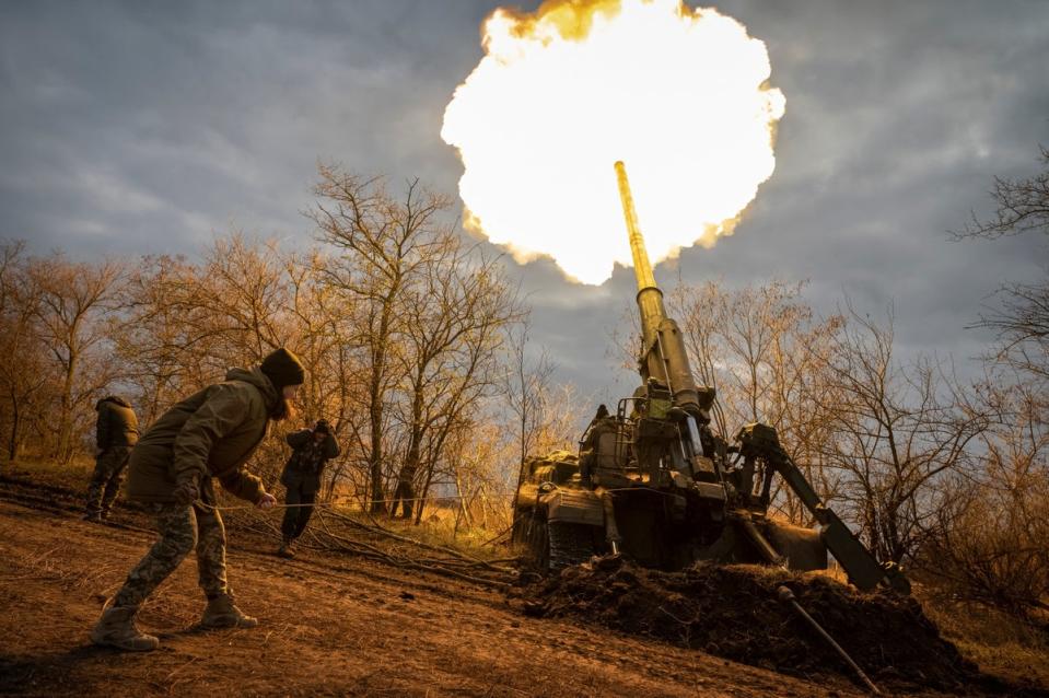 Ukrainian servicemen fire a self-propelled gun at a position on a frontline in the Kherson region (Reuters)