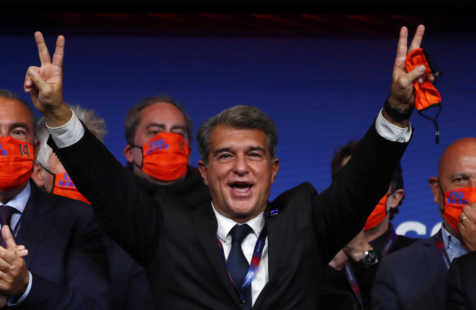 Joan Laporta celebrates his victory after elections at the Camp Nou stadium in Barcelona, Spain, Sunday, March 7, 2021. Joan Laporta has been elected Barcelona's president on Sunday, inheriting a club mired in debt and facing daunting problems that include the possible departure of Messi when his contract ends at the end of the season. (AP Photo/Joan Monfort)