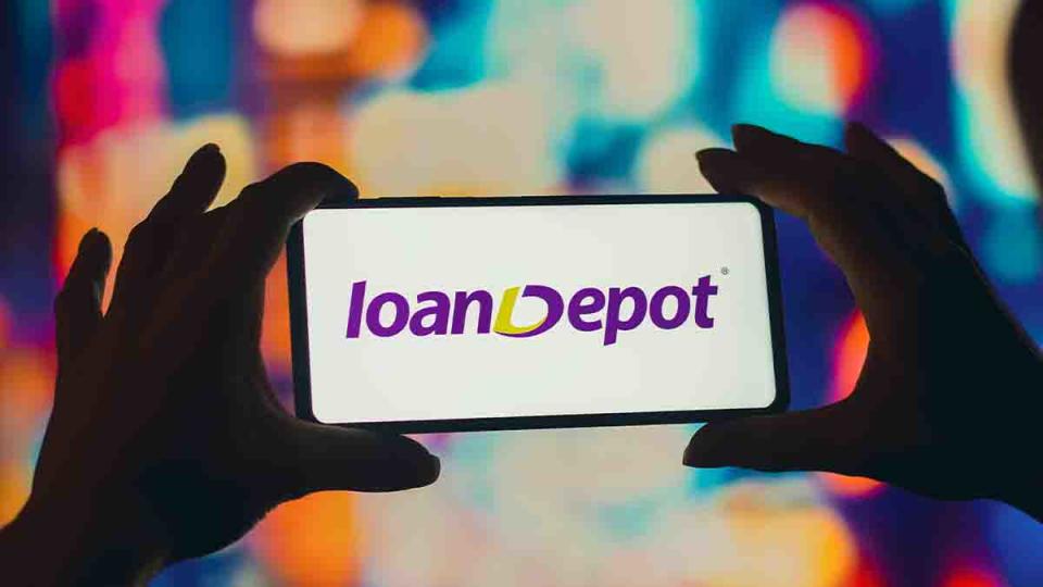 hands holding a phone with the loandepot logo
