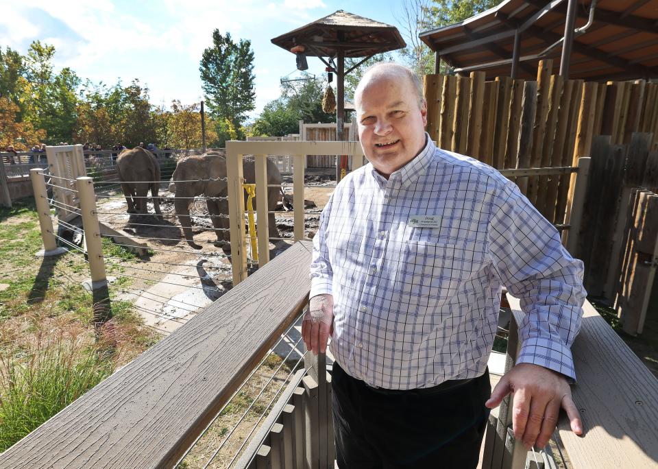 Hogle Zoo president Doug Lund stands near elephant mother Christie and daughter Zuri at the zoo in Salt Lake City on Friday, Oct. 13, 2023. The elephants are being relocated. | Jeffrey D. Allred, Deseret News