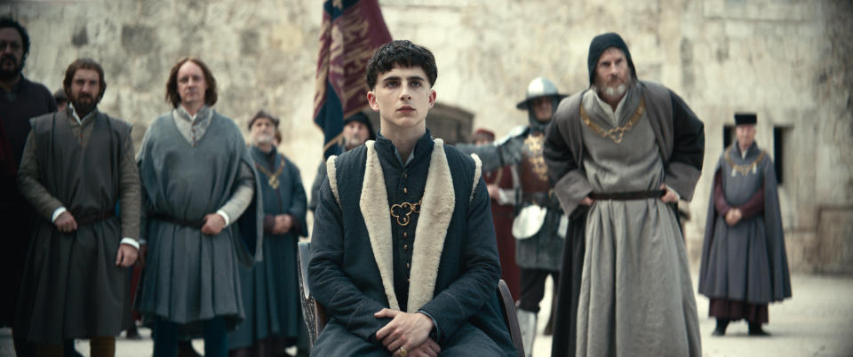 This image released by Netflix shows Timothée Chalamet, center, in a scene from "The King," in theaters on Oct. 11. (Netflix via AP)