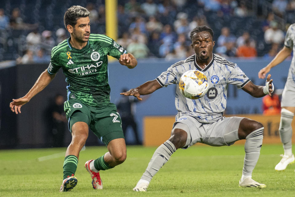 CF Montreal forward Kwadwo Opoku, right, works for the ball against New York City FC midfielder Andres Jasson during the first half of an MLS soccer match at Yankee Stadium, Wednesday, Aug. 30, 2023, in New York. (AP Photo/Eduardo Munoz Alvarez)