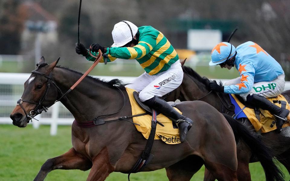 Barry Geraghty riding Defi Du Seuil (green) clears the last to win at Sandown - Getty Images Europe