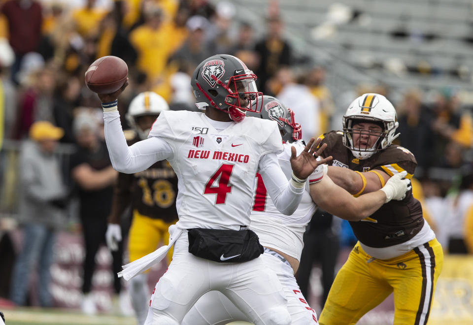 New Mexico quarterback Sheriron Jones throws a pass against Wyoming during an NCAA college football game Saturday, Oct. 19, 2019, in Laramie, Wy. (AP Photo/Michael Smith)