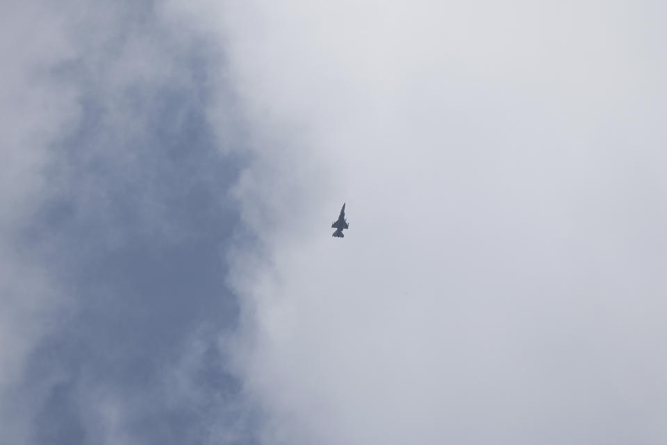 An Israeli jet fighter flies near the Gaza Strip, as seen from southern Israel, Monday, Nov. 13, 2023. (AP Photo/Ohad Zwigenberg)