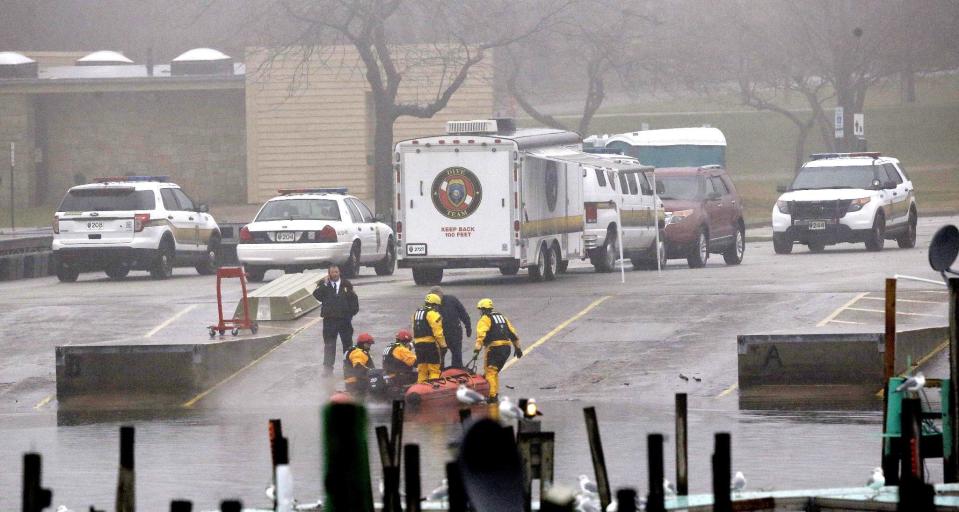 A recovery team pulls a boat out of the water at a mini command station along the shores of Lake Erie, Tuesday, Jan. 3, 2017, in Cleveland. Cleveland officials say the search for a plane carrying six people that disappeared last week over Lake Erie has resumed. Tuesday marks the third straight day that conditions have allowed recovery teams to search the lake for a Columbus-bound Cessna 525 Citation that vanished from radar shortly after takeoff Thursday night from Burke Lakefront Airport. (AP Photo/Tony Dejak)