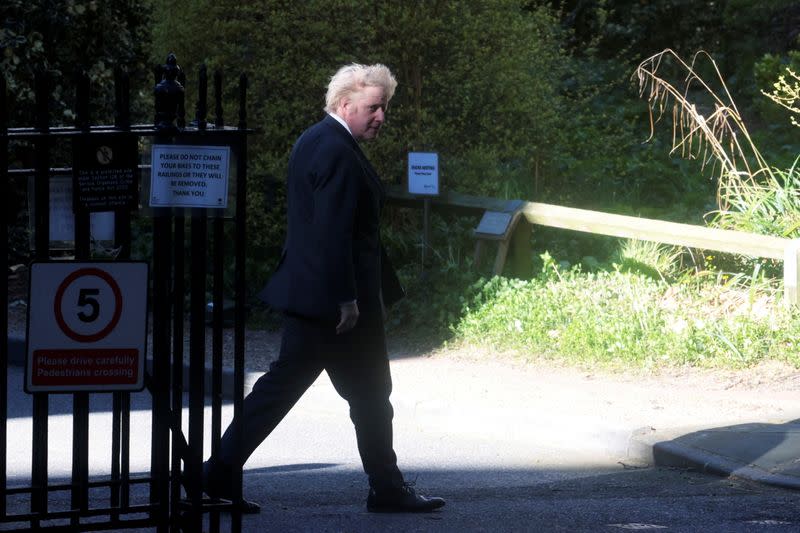 Britain's Prime Minister Boris Johnson walks at Downing Street in London