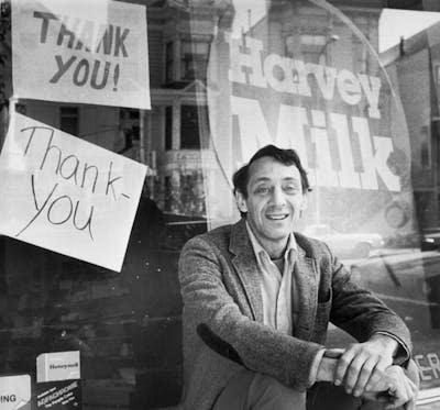 Supervisor Harvey Milk sits outside his camera shop in November 1977. <a href="https://www.gettyimages.com/detail/news-photo/avowed-homosexual-supervisor-harvey-milk-who-was-shot-and-news-photo/517432258?adppopup=true" rel="nofollow noopener" target="_blank" data-ylk="slk:Bettmann via Getty Images;elm:context_link;itc:0;sec:content-canvas" class="link ">Bettmann via Getty Images</a>