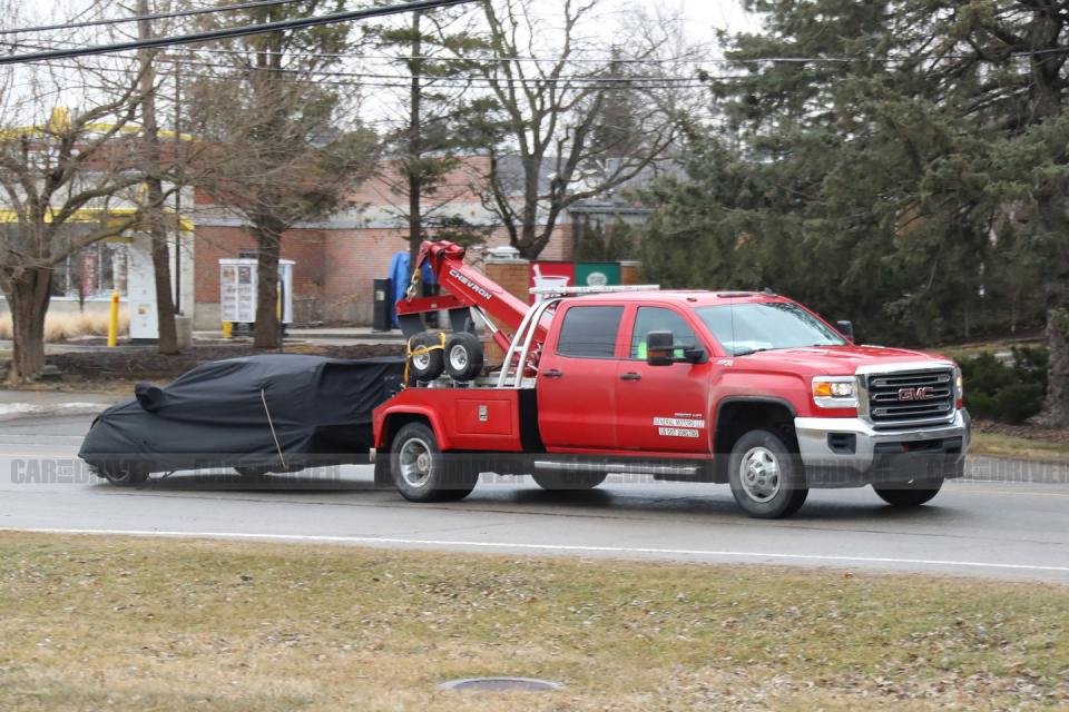<p>We're somewhat surprised to see the Corvette prototype being towed in this manner, and it seems strange that GM didn't bring a flatbed truck to haul the precious C8 prototype around.</p>
