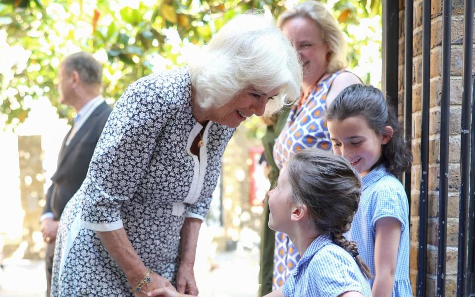 Queen Camilla is greeted by pupils at Christ Church CofE primary school in Chelsea