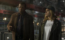 This image released by Disney-Marvel shows Samuel L. Jackson as a younger Nick Fury, left, and Brie Larson in a scene from "Captain Marvel. New digital de-aging techniques have shaved decades from Jackson's face. (Disney/Marvel Studios via AP)