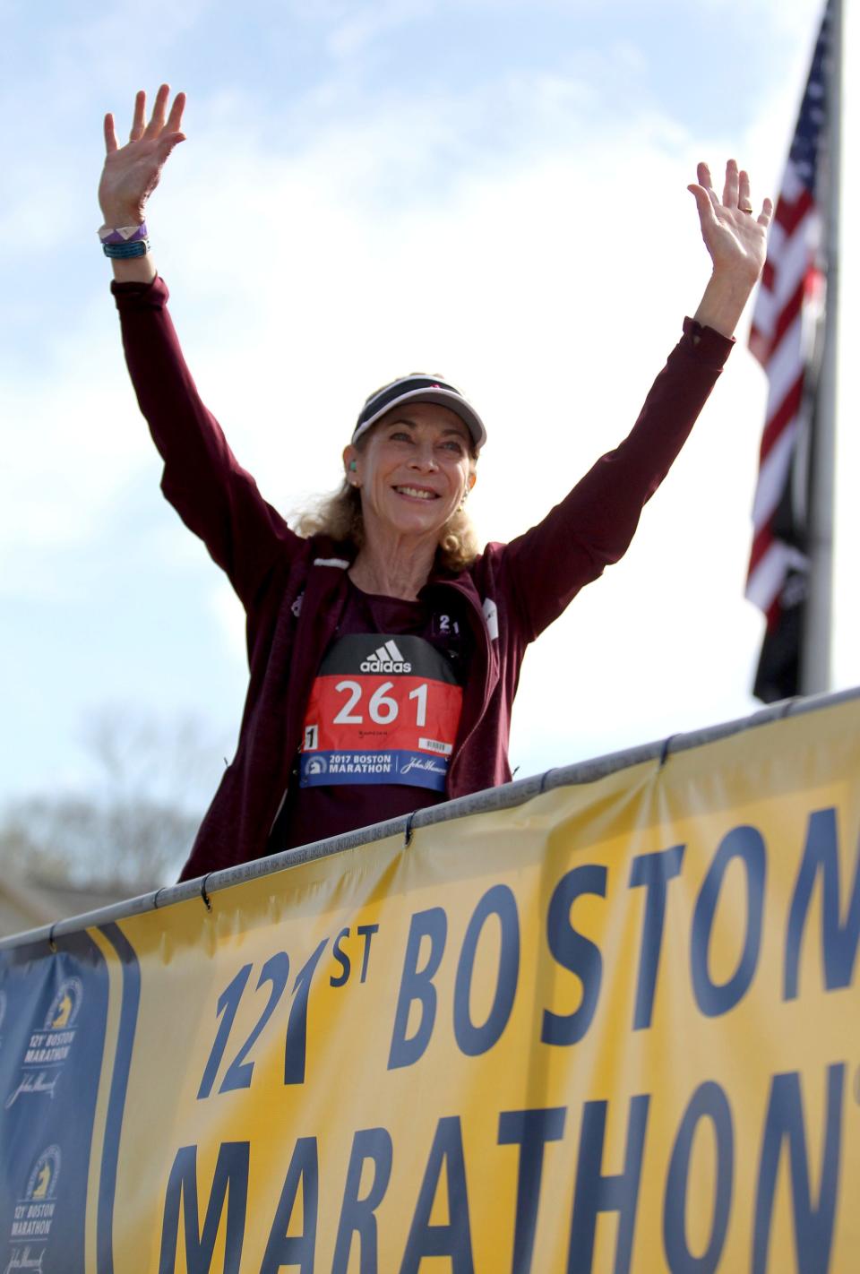 Kathrine Switzer, who was the first official woman entrant in the Boston Marathon 50 years ago, waves to the crowd at the start of the 2017 Boston Marathon in Hopkinton, Mass., April 17, 2017.
