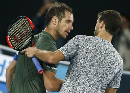 Tennis - Australian Open - Melbourne Park, Melbourne, Australia - early 22/1/17 Bulgaria's Grigor Dimitrov embraces after winning his Men's singles third round match against France's Richard Gasquet. REUTERS/Thomas Peter