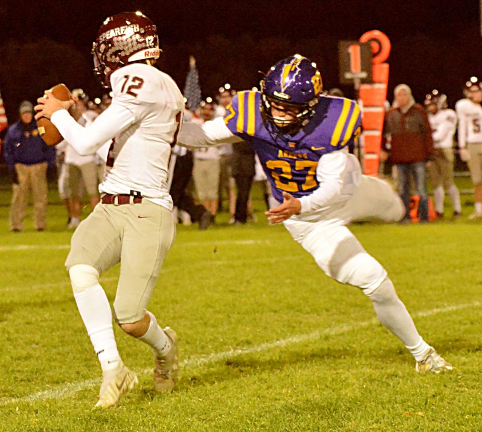 Watertown's Spencer Wientjes (right) sacks Spearfish quarterback Seth Hamilton during their Class 11AA high school football game on Friday, Oct. 14, 2022 at Watertown Stadium. The Arrows won 26-7.