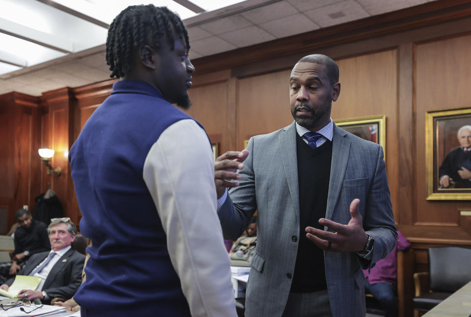 Attorney Keenan Carter, right, and Davonte Pack go over the details of a fight during a hearing in Judge Carol Chumney's courtroom on Tuesday, Dec. 12, 2023, in Memphis, Tenn. The hearing is to determine whether Ja Morant used self defense during a fight last summer at his home. (Patrick Lantrip/Daily Memphian via AP)