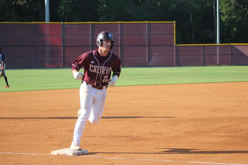 Benedictine sophomore Parker McCoy circles third base after hitting his eighth homer of the season in a playoff win over Westover on April 27.