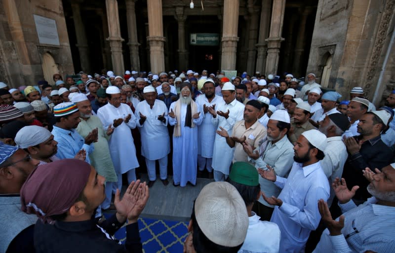 Muslims pray for the eradication of coronavirus disease (COVID-19) after attending Friday prayers at Juma Masjid in Ahmedabad