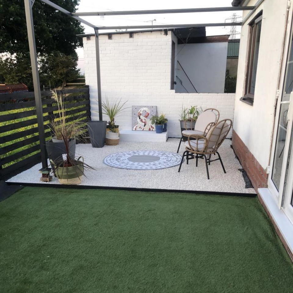 pergola in garden with boho furniture