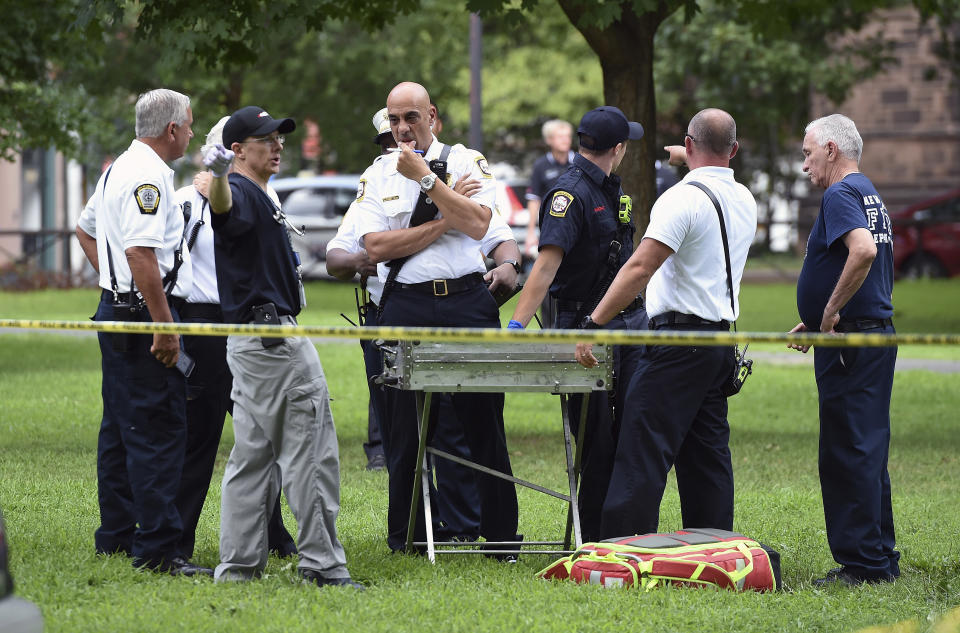 New Haven emergency personnel respond to overdose cases on the New Haven Green in Connecticut on Wednesday, Aug. 15, 2018. More than 30 people overdosed Wednesday from a suspected bad batch of “K2” synthetic marijuana at or near a city park in Connecticut. No deaths were reported, but officials said two people had life-threatening symptoms. (Arnold Gold/New Haven Register via AP)