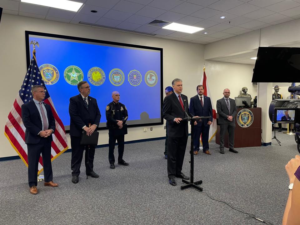 U.S. Attorney Roger B. Handberg, who oversees the Middle District of Florida, speaks to reporters inside the Ocala Police Department's Community Room about combating violent crime.