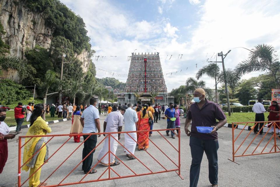 Hindu devotees observe standard operating procedures at the Kallumalai Arulmigu Subramaniar Temple in Gunung Cheroh, Ipoh during Thaipusam January 18, 2022. — Picture by Farhan Najib