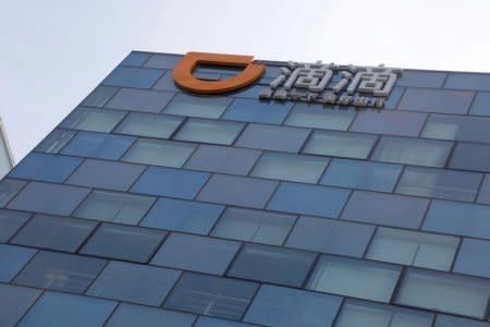 FILE PHOTO: Logo of Didi Chuxing is seen at its headquarters building in Beijing, China, May 18, 2016. REUTERS/Kim Kyung-Hoon/File Photo