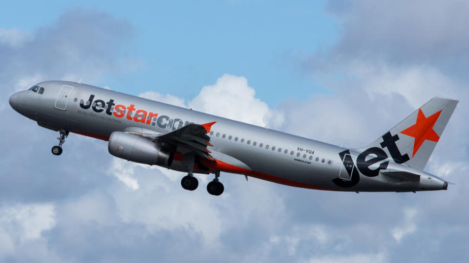 A Jetstar plane in the sky