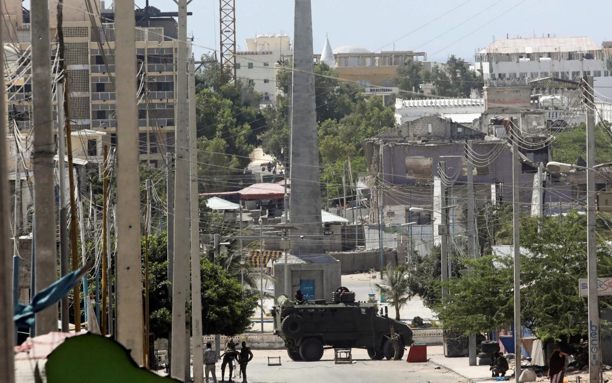 An armoured personnel carrier on a sealed off street during fighting between Somali government forces and opposition troops  - REUTERS/Feisal Omar