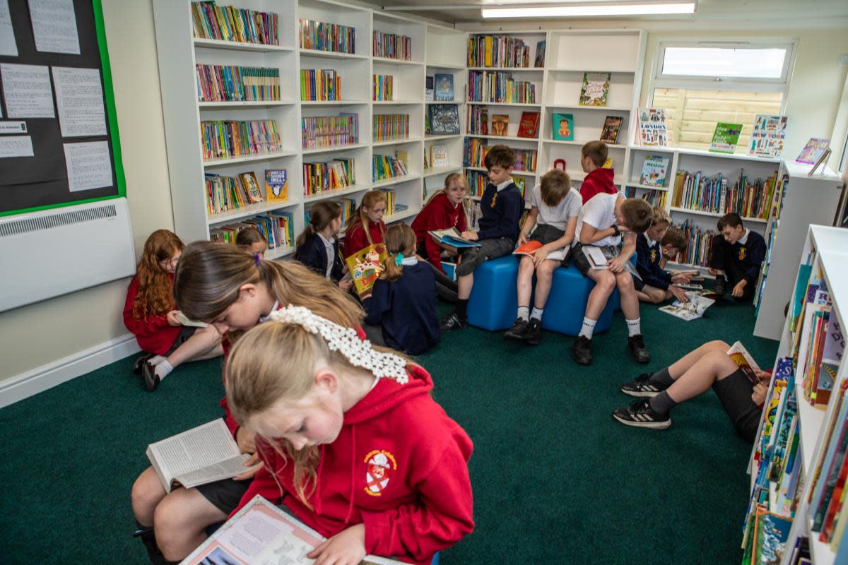 Pupils at Burneston Primary School enjoy reading in their new library